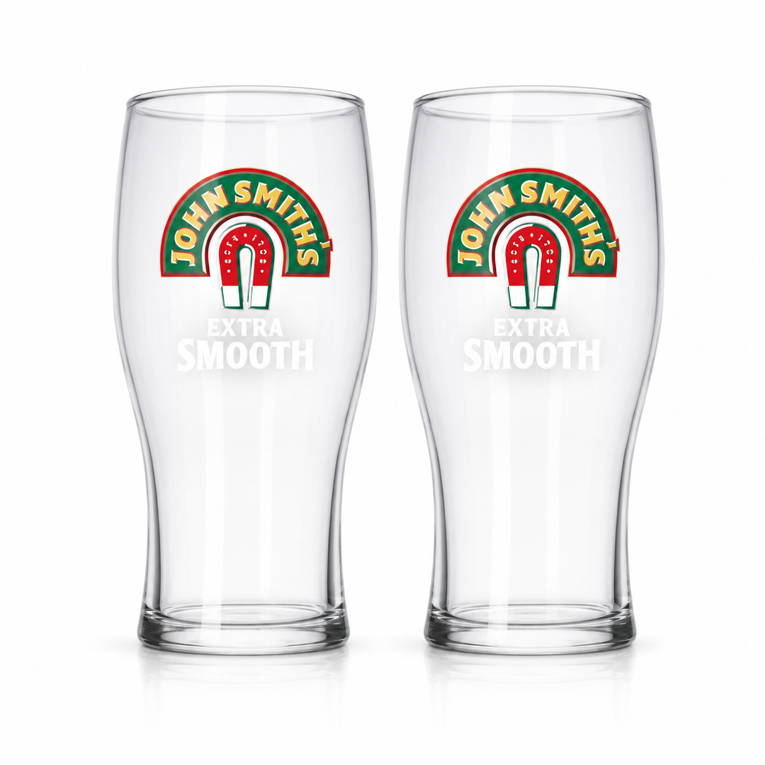 Two empty John Smith’s Extra Smooth pint glasses on a white background.
