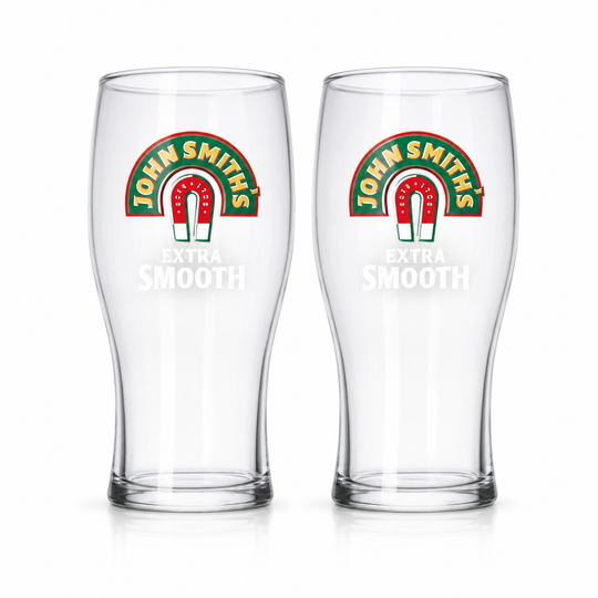 Two empty John Smith’s Extra Smooth pint glasses on a white background.
