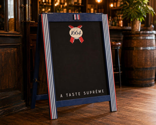 Kronenbourg 1664 branded A-frame chalkboard pub sign with blue striped frame